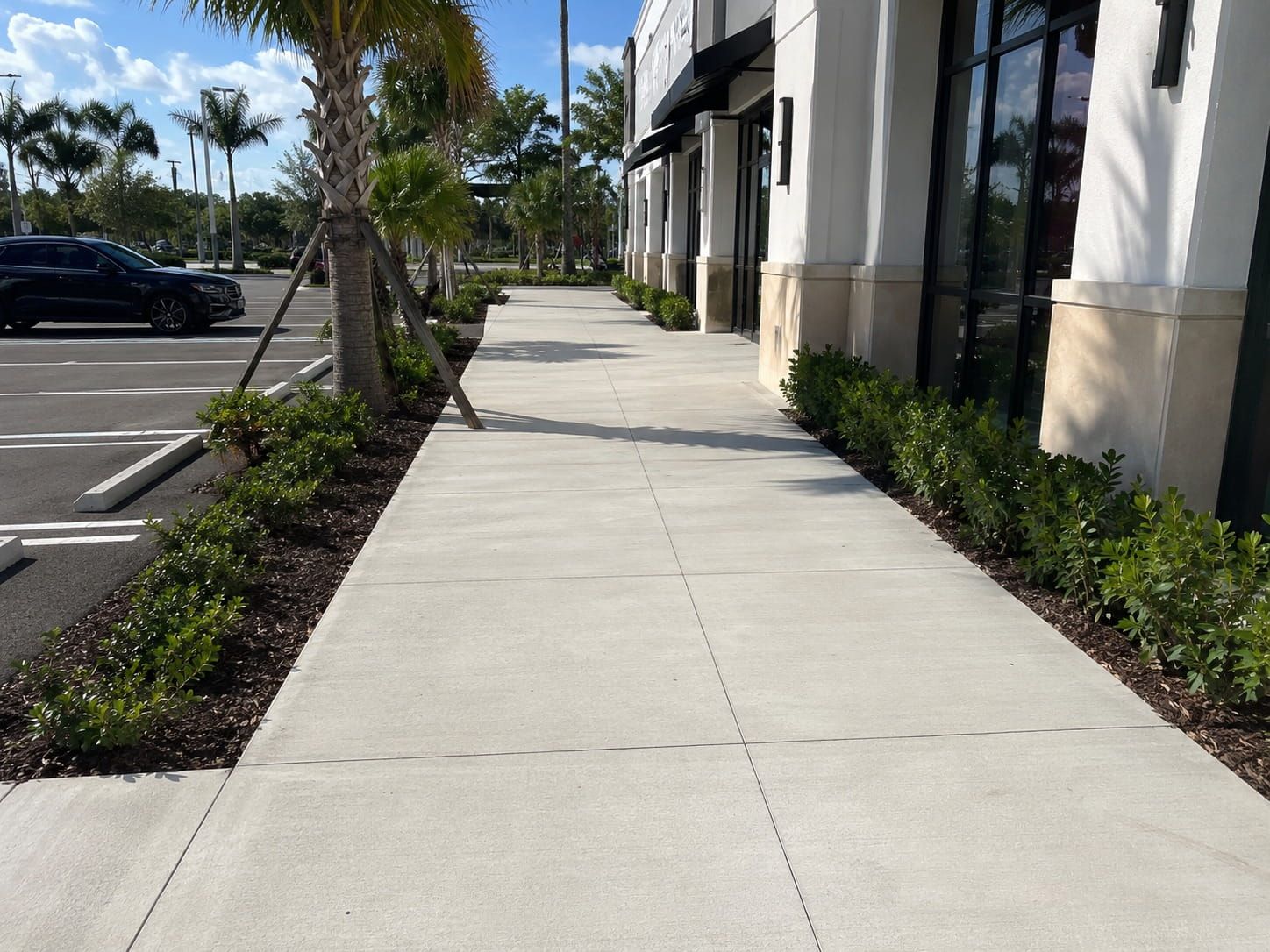 commercial sidewalk outside a Miami retail storefront