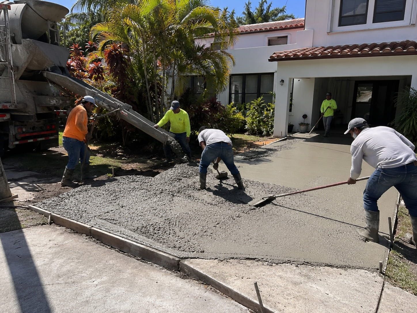 Miami concrete driveway specialist finishing a project