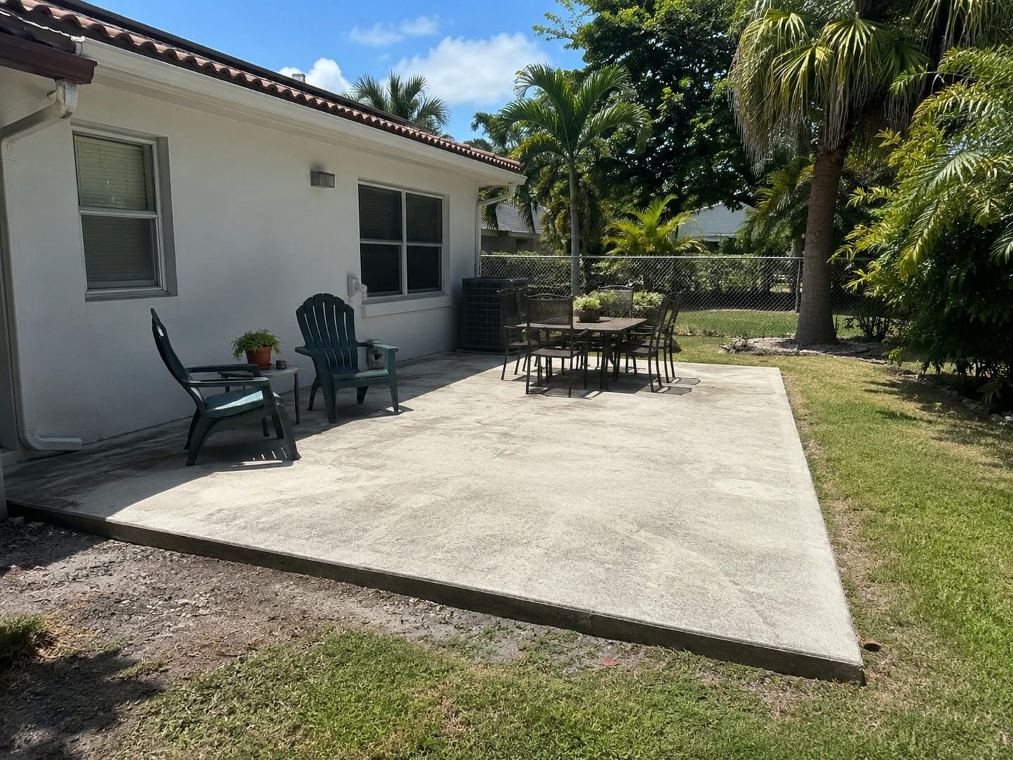 concrete patio with outdoor seating in a Miami backyard