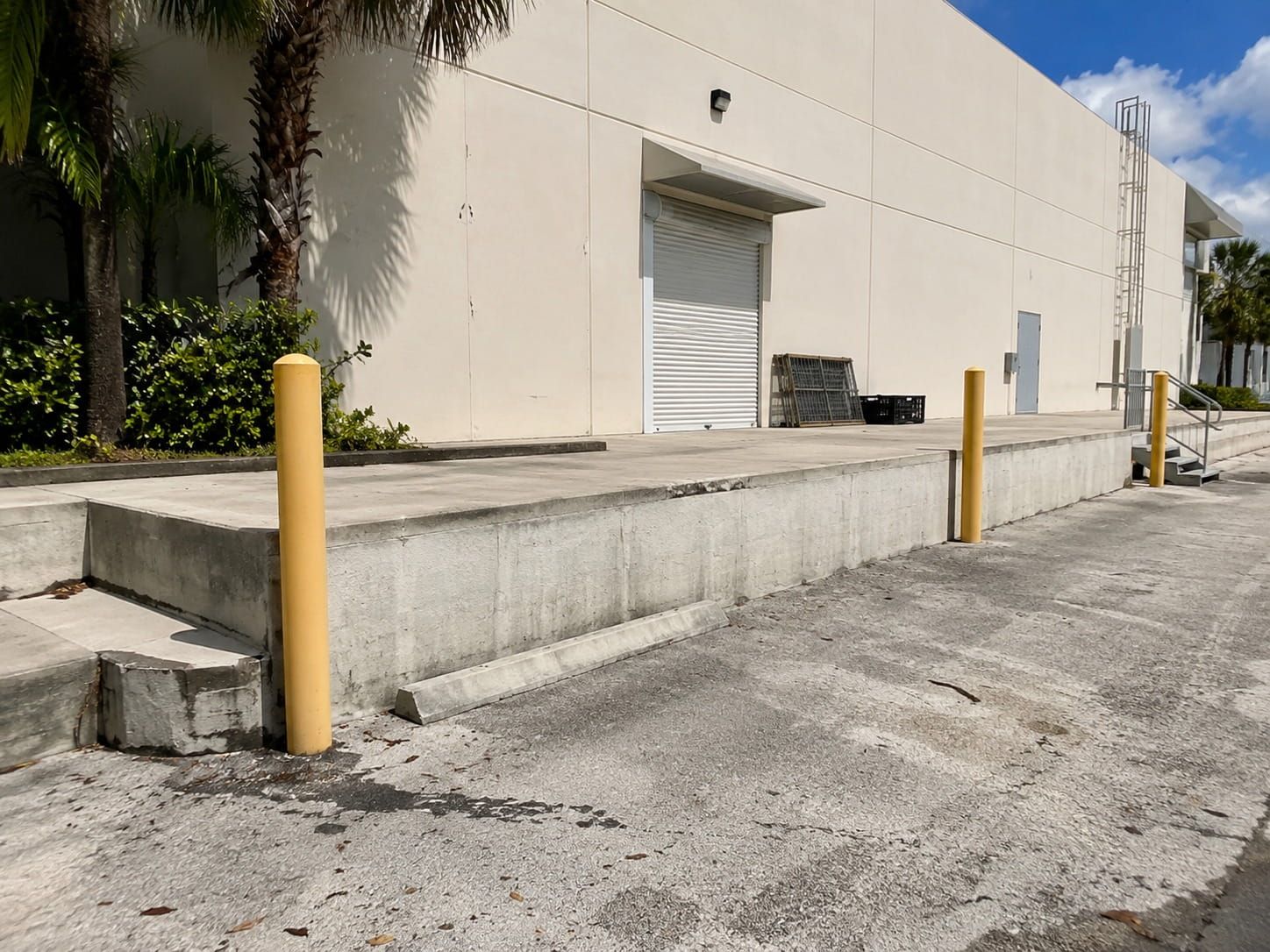raised warehouse loading dock staging area with bollards in Miami